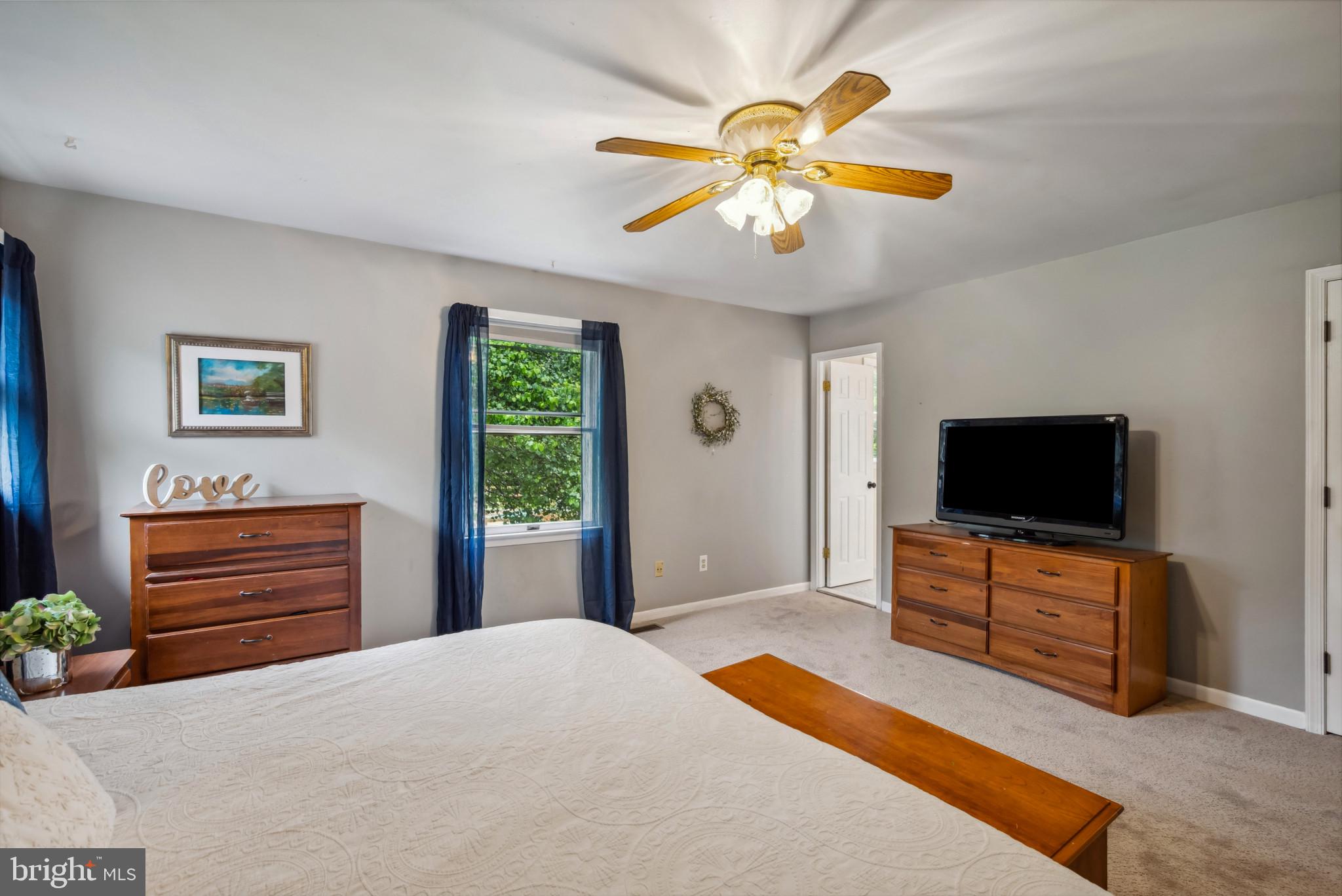 3825 Salem Bottom Road Westminster, MD 21157 - Photo 12 of 43 a bedroom with a bed and a flat screen tv