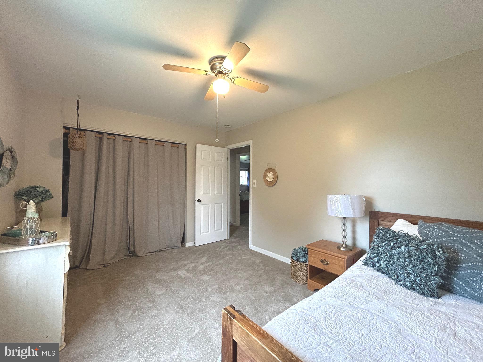 3825 Salem Bottom Road Westminster, MD 21157 - Photo 16 of 43 a bedroom with a bed and a chandelier
