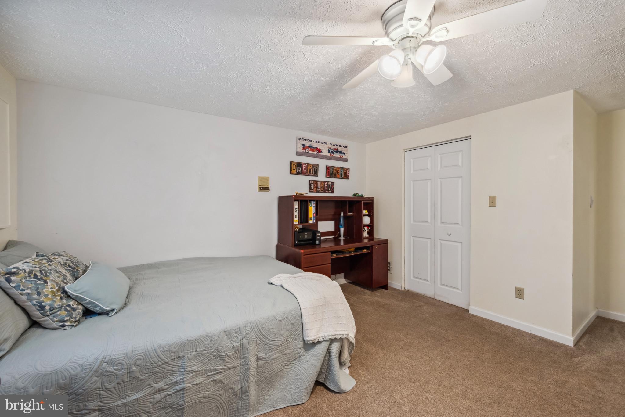 3825 Salem Bottom Road Westminster, MD 21157 - Photo 26 of 43 a bedroom with a bed and a chandelier