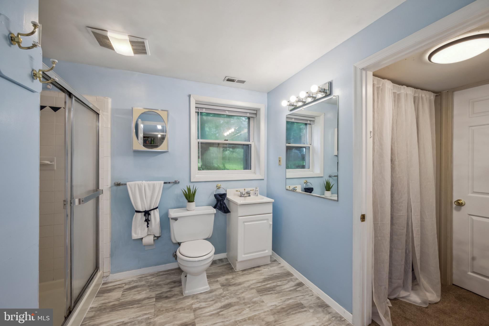 3825 Salem Bottom Road Westminster, MD 21157 - Photo 27 of 43 a bathroom with a toilet sink and mirror