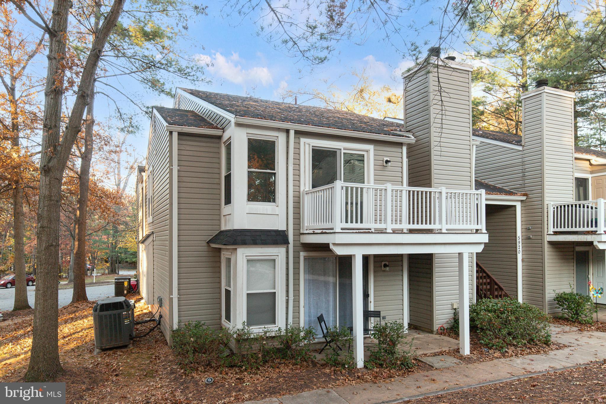 5920 Watch Chain Way, Unit 5106 Columbia, MD 21044 - Photo 20 of 27 a front view of a house with plants and trees