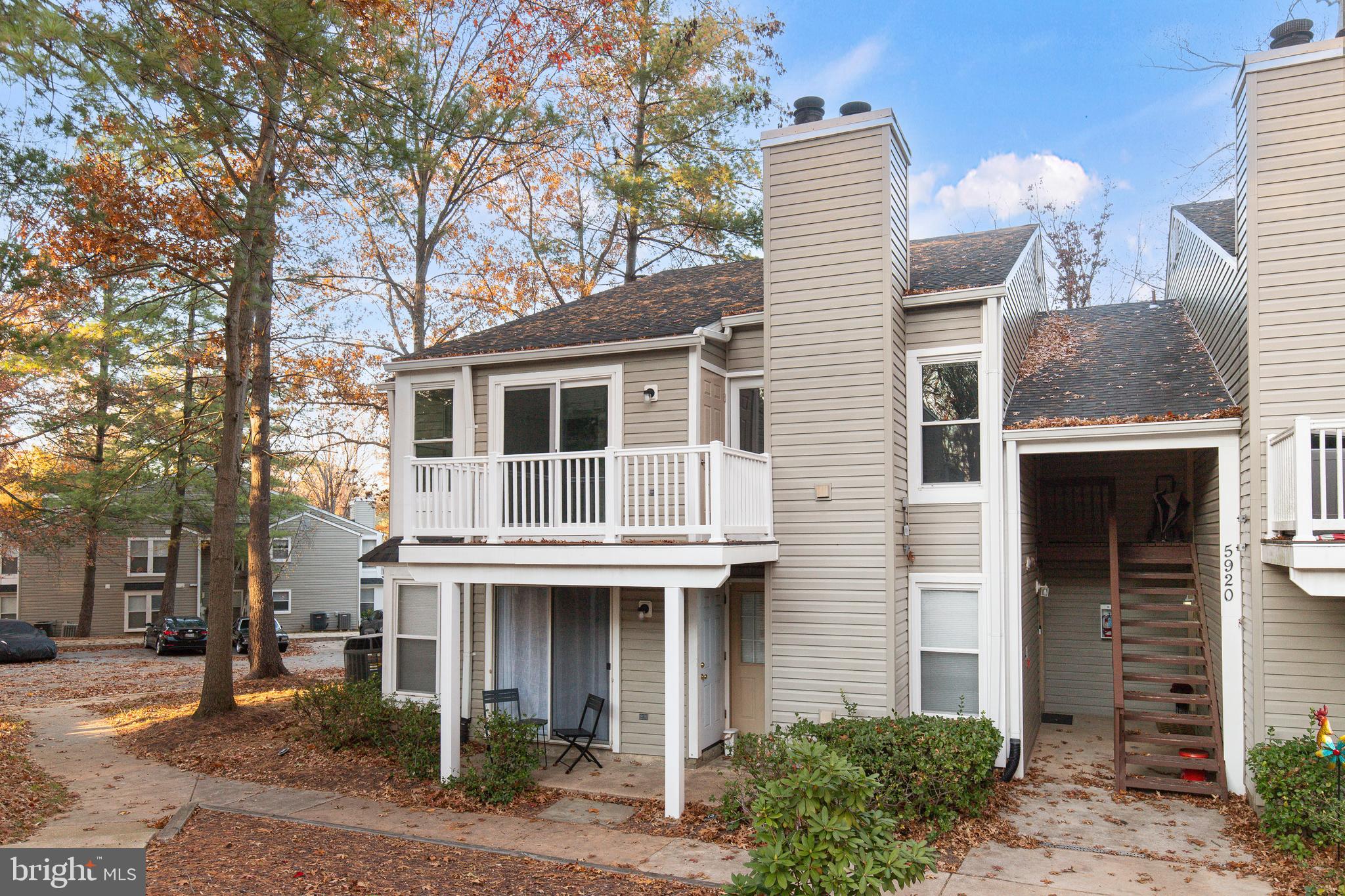 5920 Watch Chain Way, Unit 5106 Columbia, MD 21044 - Photo 22 of 27 a front view of a house with a garden