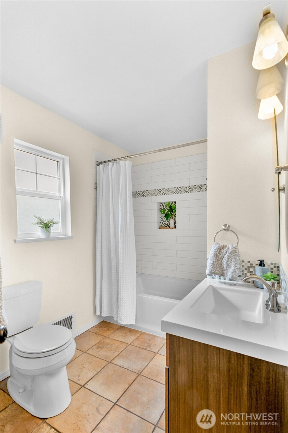 245 Wells Avenue North Renton, WA 98057 - Photo 17 of 26 a bathroom with a sink a toilet and mirror