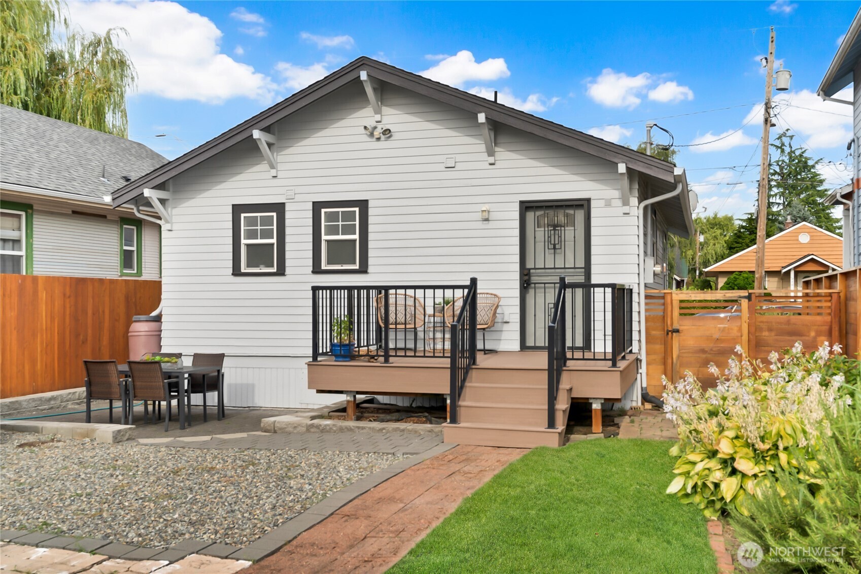 245 Wells Avenue North Renton, WA 98057 - Photo 21 of 26 a view of a house with a yard and wooden fence