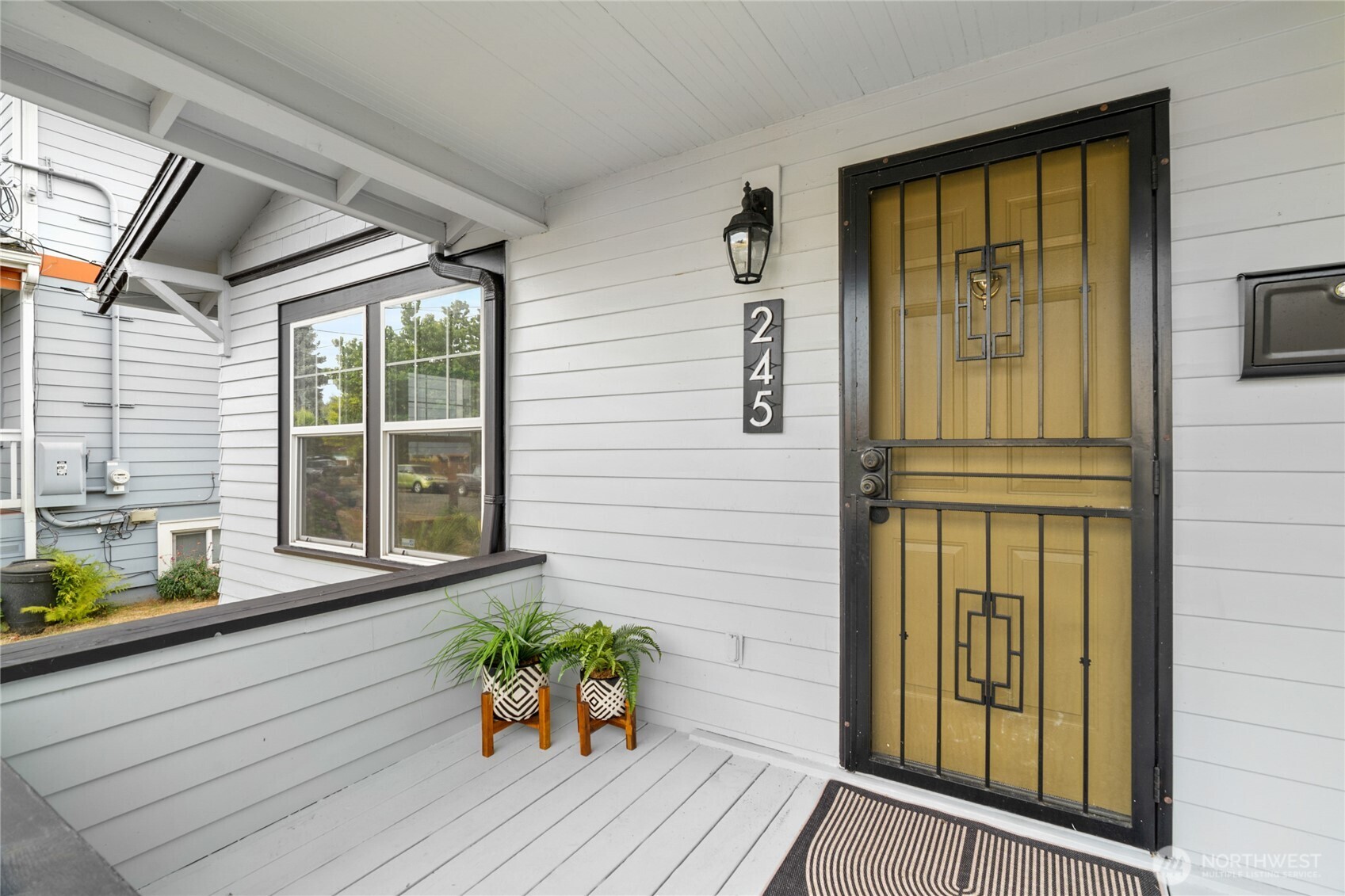 245 Wells Avenue North Renton, WA 98057 - Photo 4 of 26 a front view of a house with outdoor seating