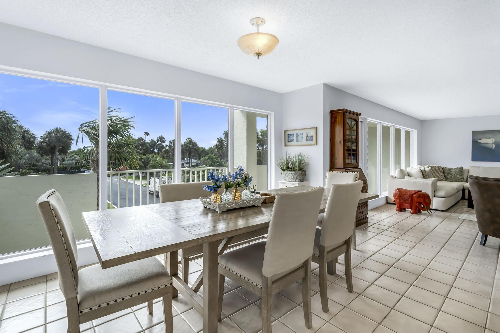 4301 North Ocean Boulevard, Unit A206 Boca Raton, FL 33431 - Photo 12 of 65 a view of a dining room with furniture window and outside view