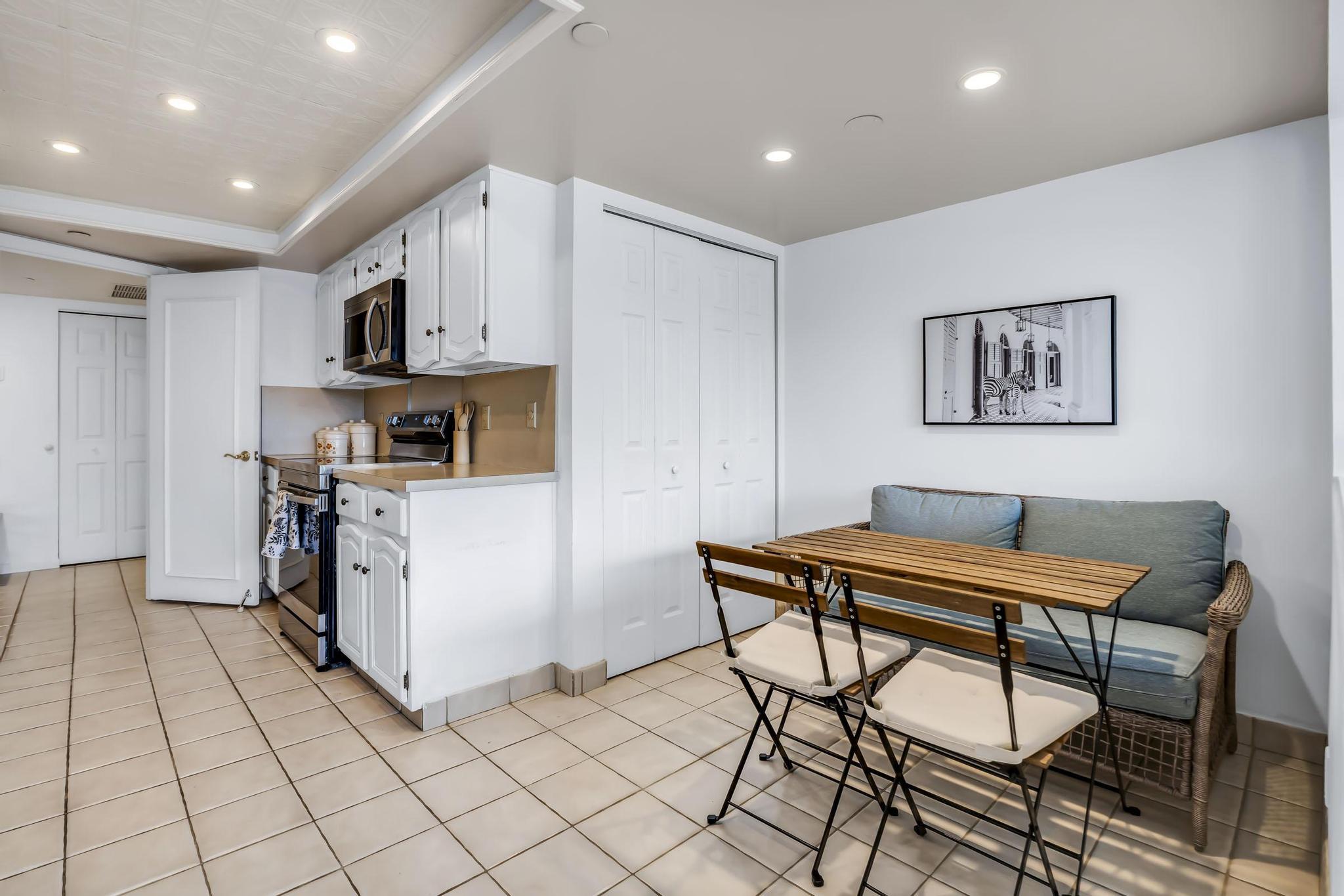 4301 North Ocean Boulevard, Unit A206 Boca Raton, FL 33431 - Photo 15 of 65 a view of kitchen with furniture and wooden floor