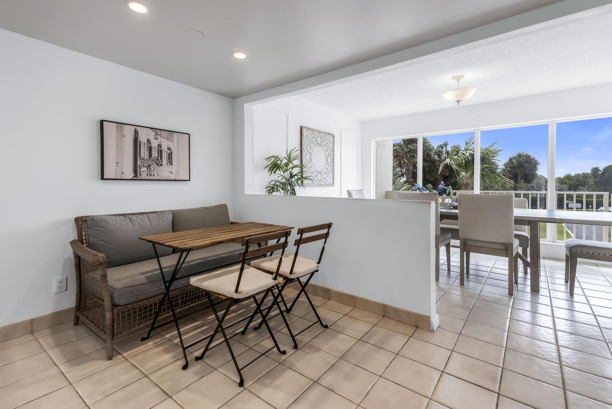 4301 North Ocean Boulevard, Unit A206 Boca Raton, FL 33431 - Photo 19 of 65 a view of a dining room with furniture window and outside view