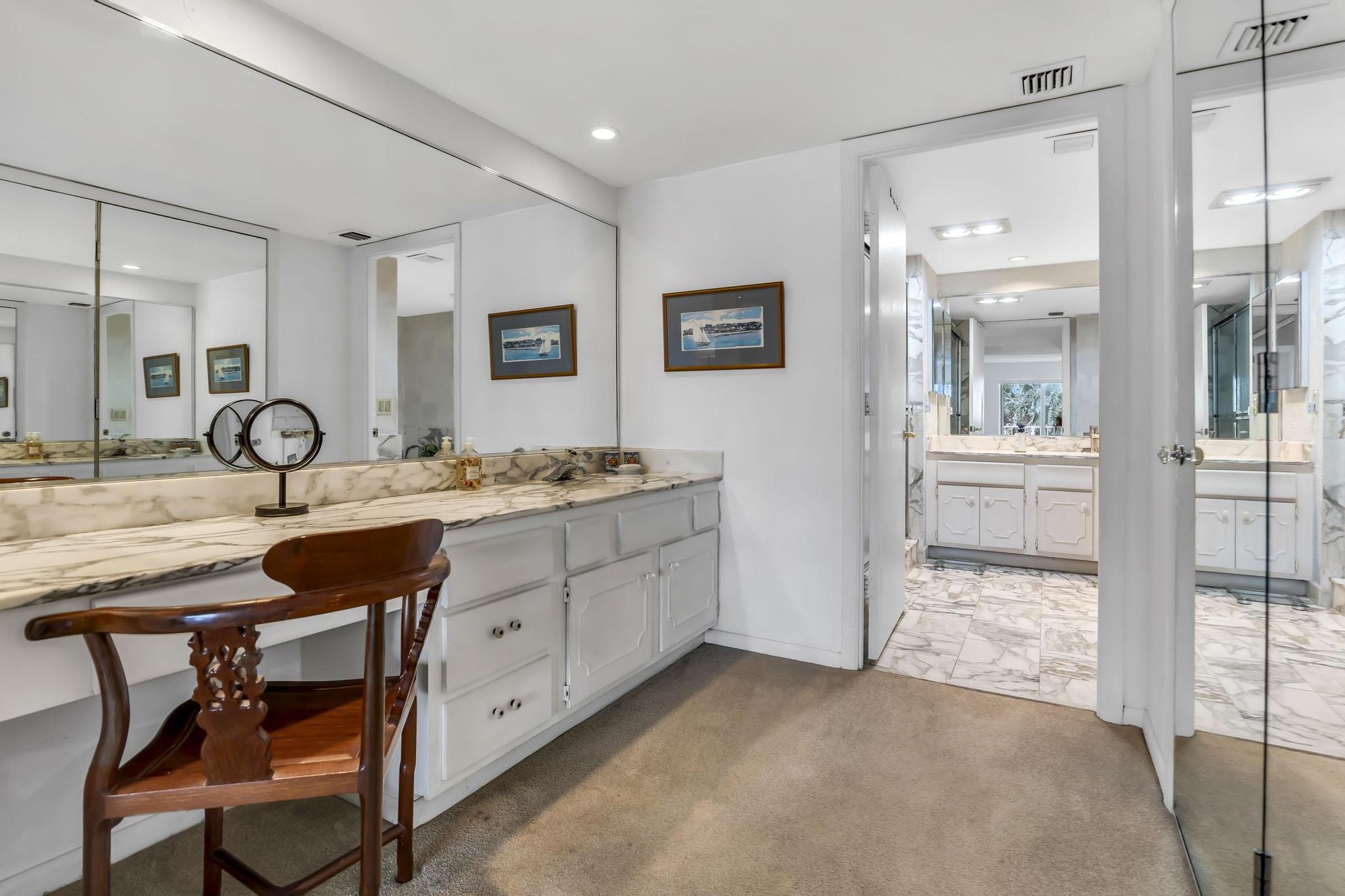 4301 North Ocean Boulevard, Unit A206 Boca Raton, FL 33431 - Photo 23 of 65 a spacious bathroom with a granite countertop sink and a mirror