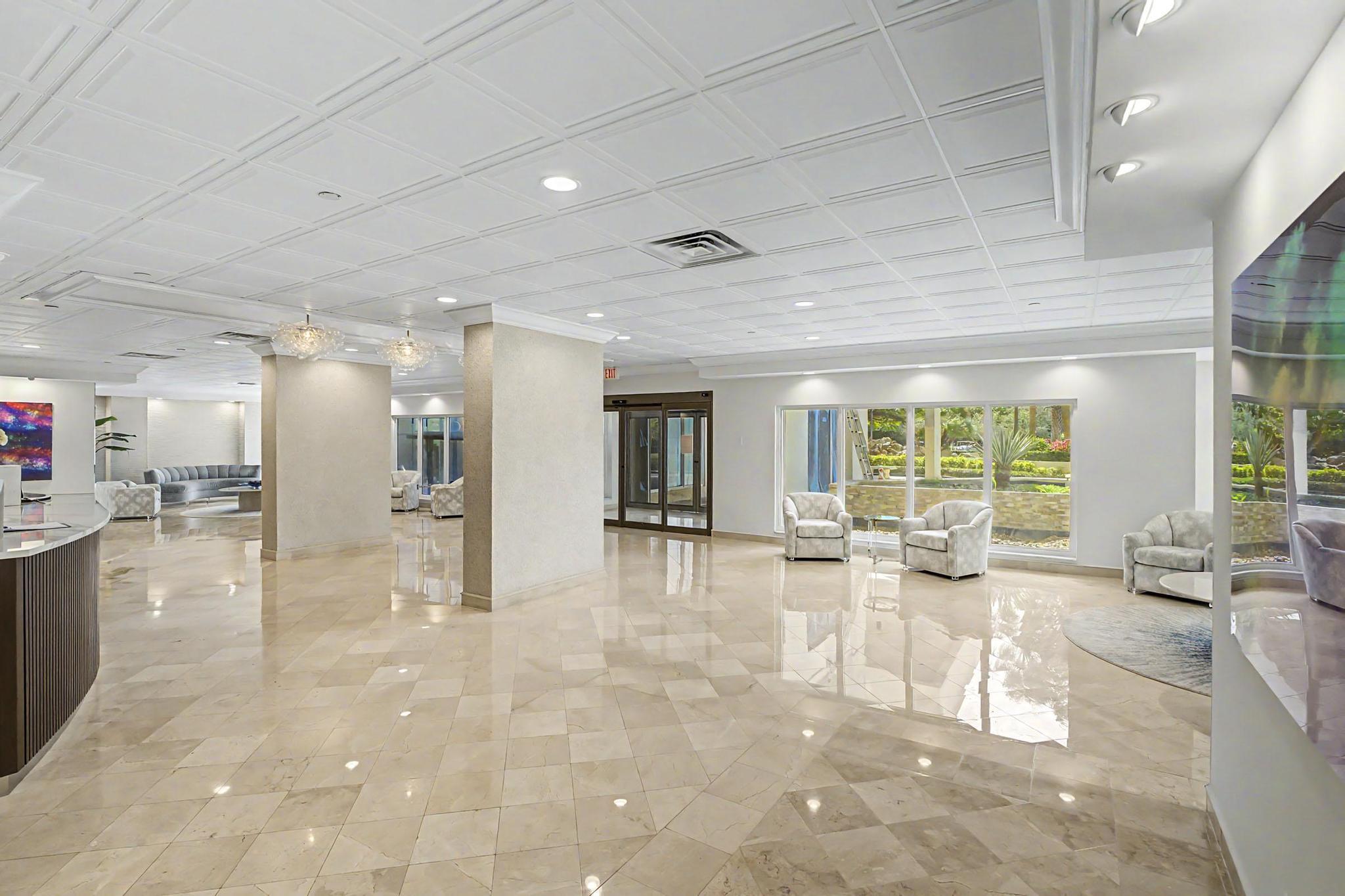 4301 North Ocean Boulevard, Unit A206 Boca Raton, FL 33431 - Photo 51 of 65 a living room with furniture and a large window