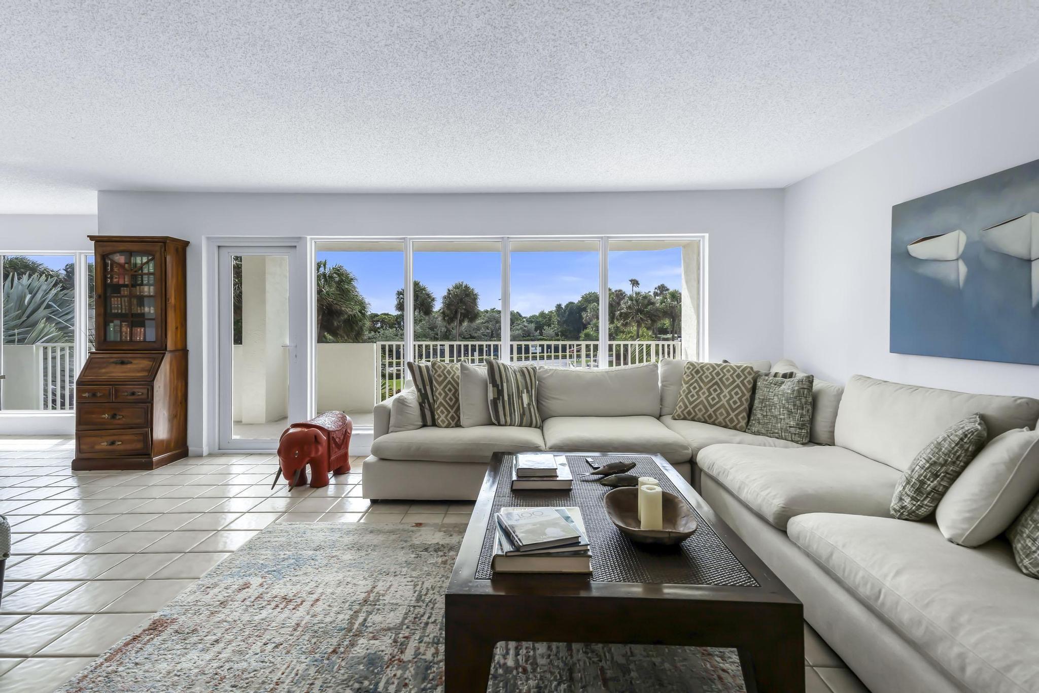 4301 North Ocean Boulevard, Unit A206 Boca Raton, FL 33431 - Photo 7 of 65 a living room with furniture and a large window