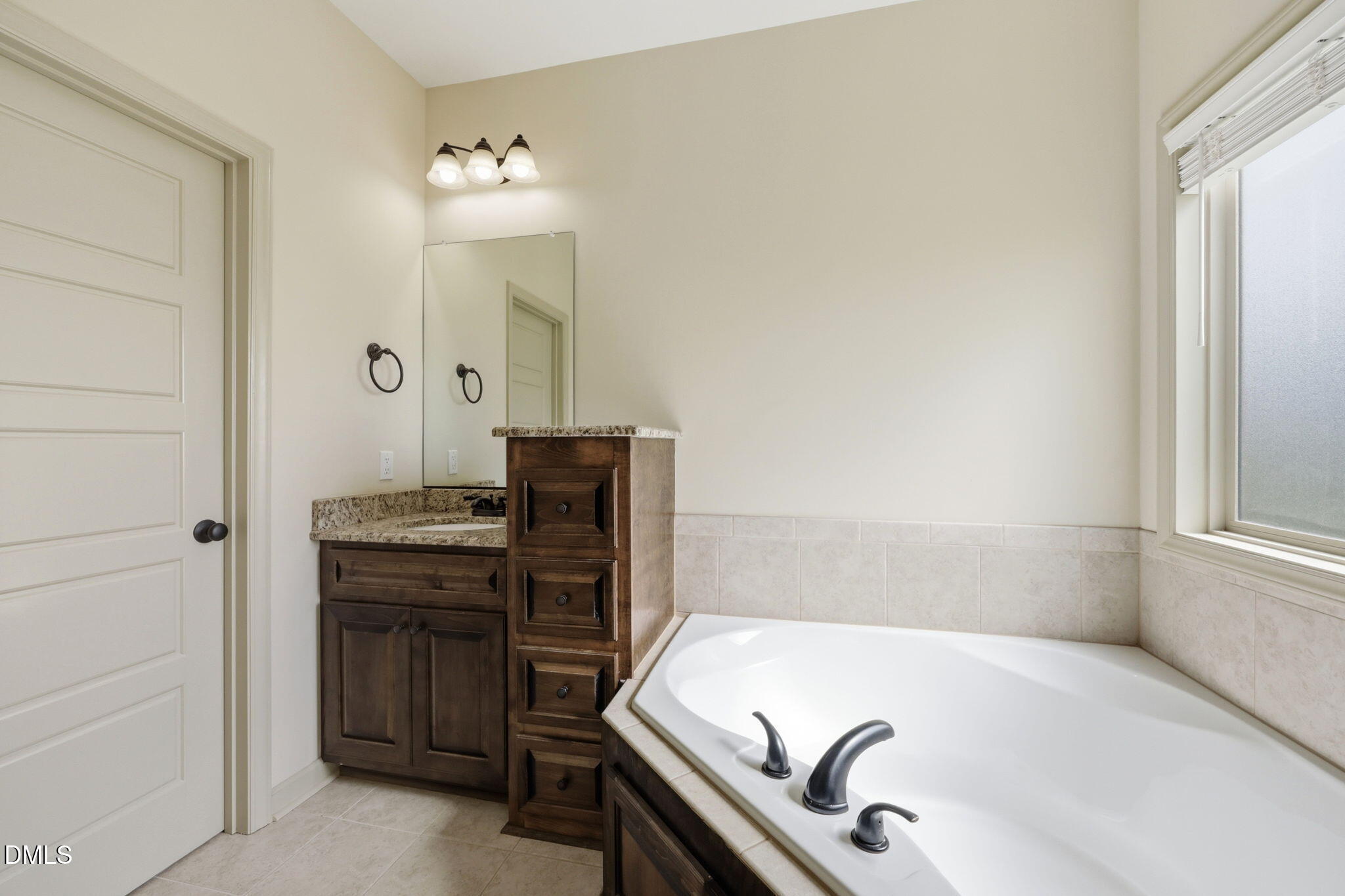 3587 Hannah Creek Road Benson, NC 27504 - Photo 20 of 43 a bathroom with a bathtub and a sink