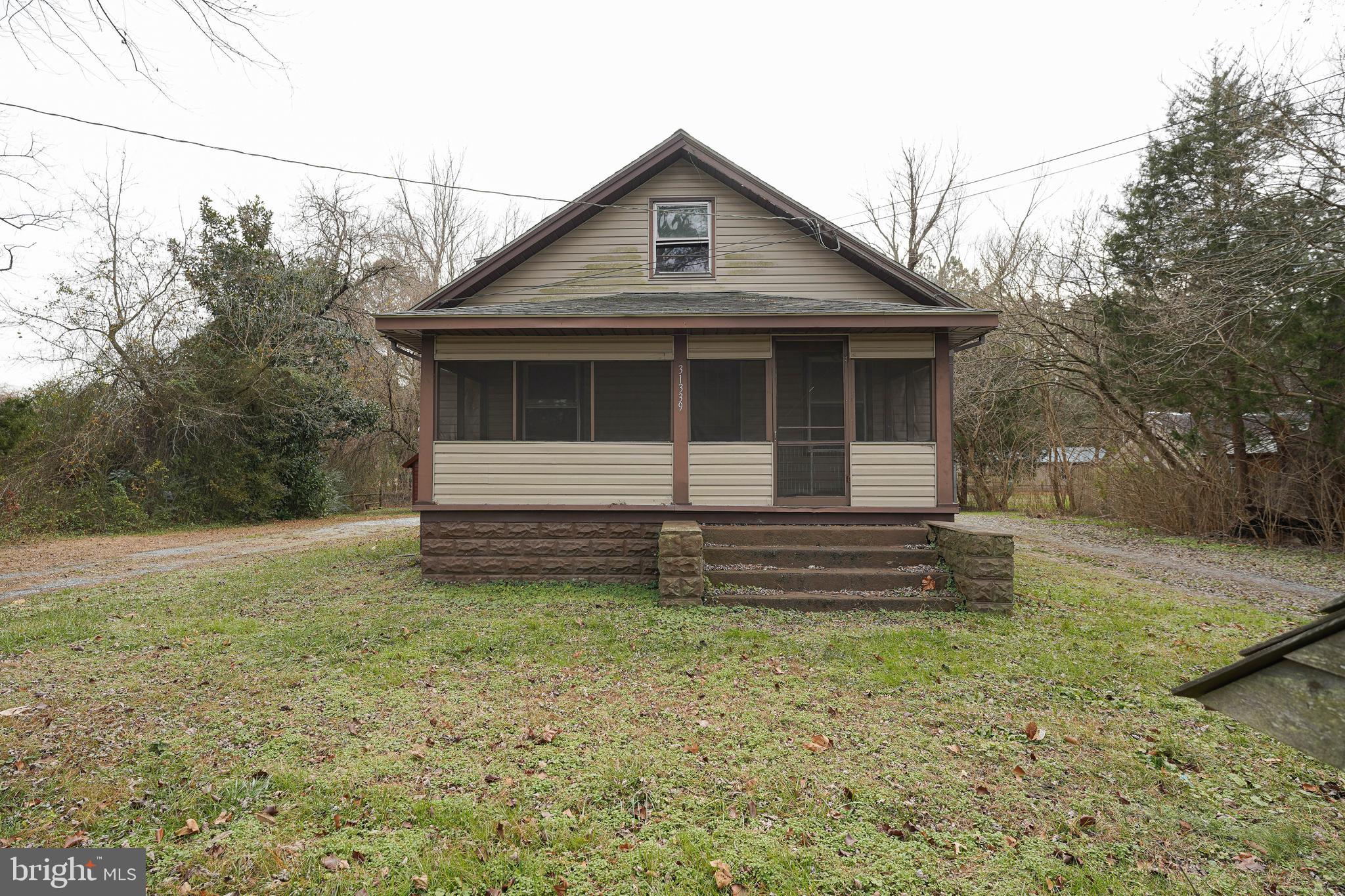31339 Old Ocean City Road Salisbury, MD 21804 - Photo 2 of 52 a front view of a house with a yard