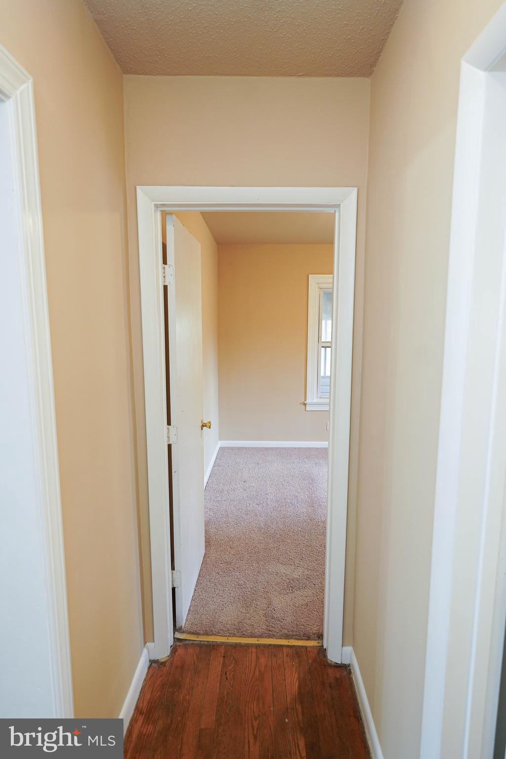31339 Old Ocean City Road Salisbury, MD 21804 - Photo 28 of 52 a view of a hallway with wooden floor