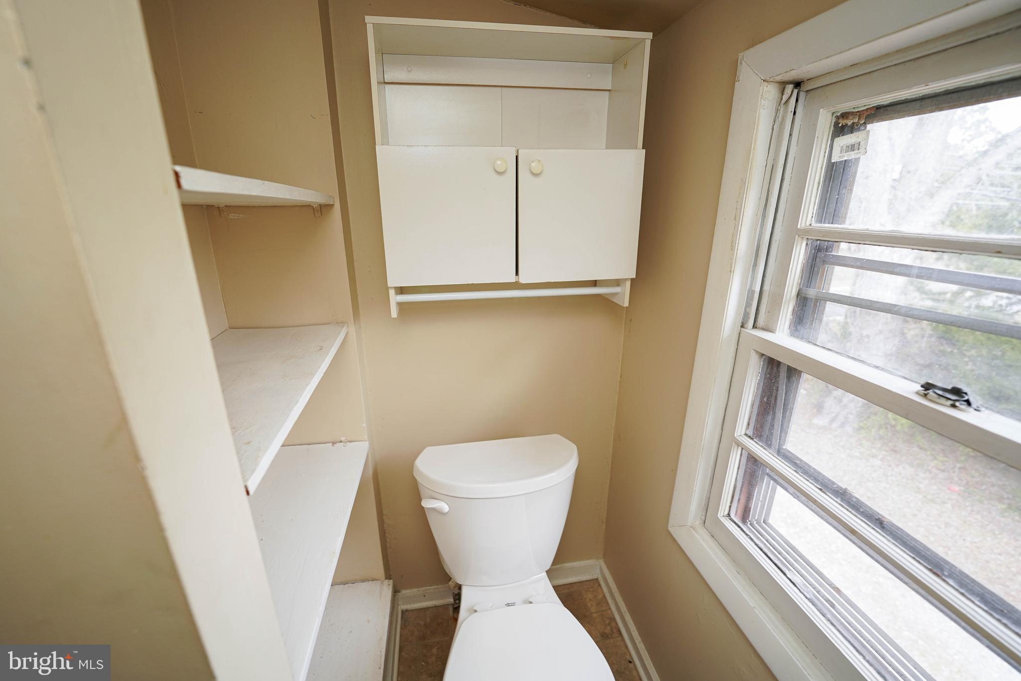 31339 Old Ocean City Road Salisbury, MD 21804 - Photo 52 of 52 a bathroom with a toilet and a sink