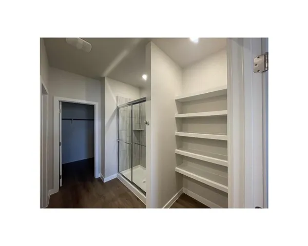 a bathroom with a tub and a shower