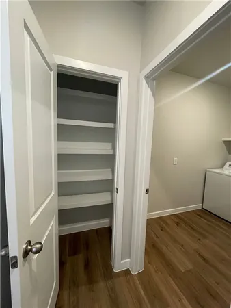 a view of room with wooden floor