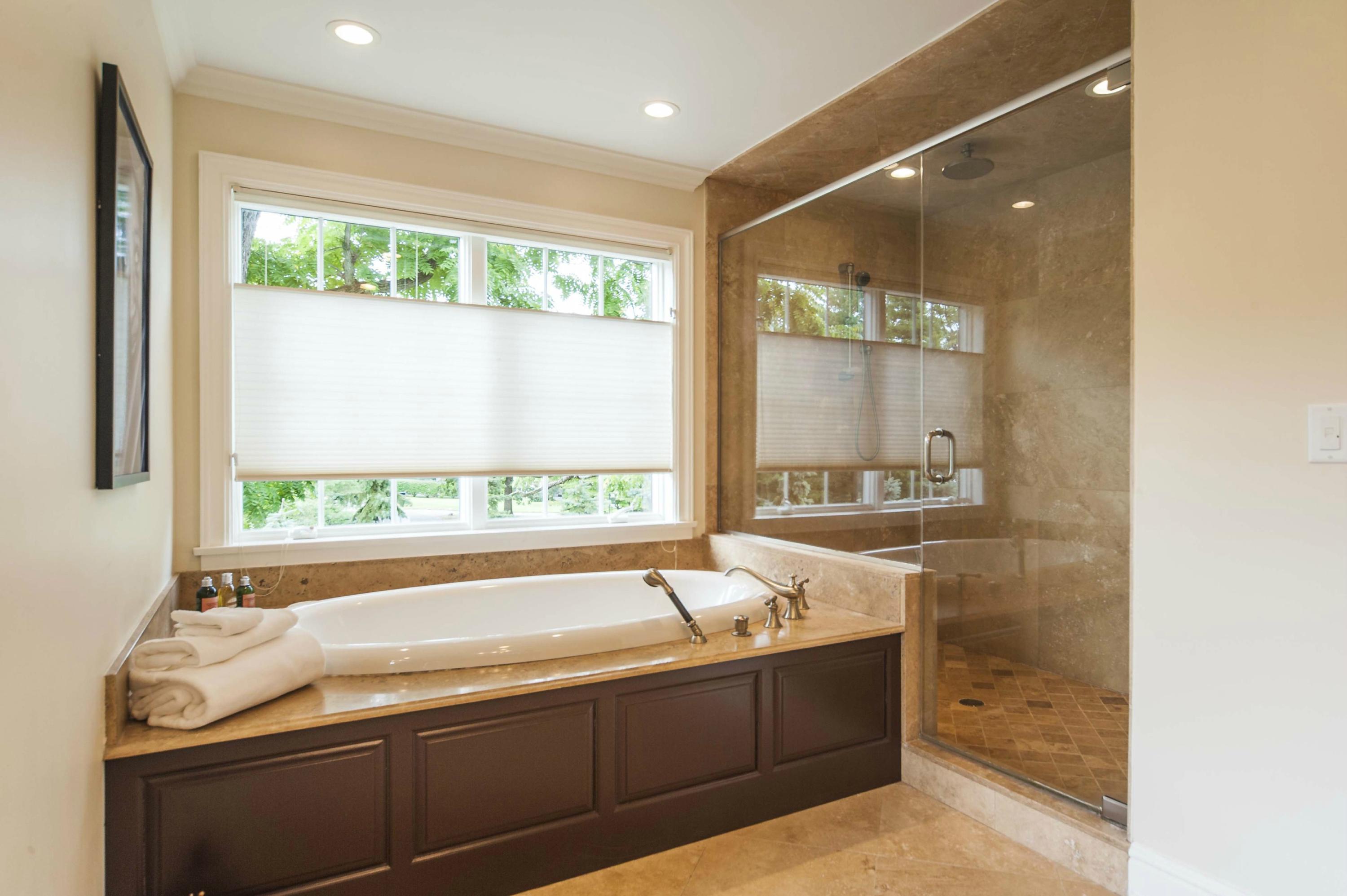 2 Hampton Road Darien, CT 06820 - Photo 15 of 25 a bath tub sitting in a bathroom next to a window