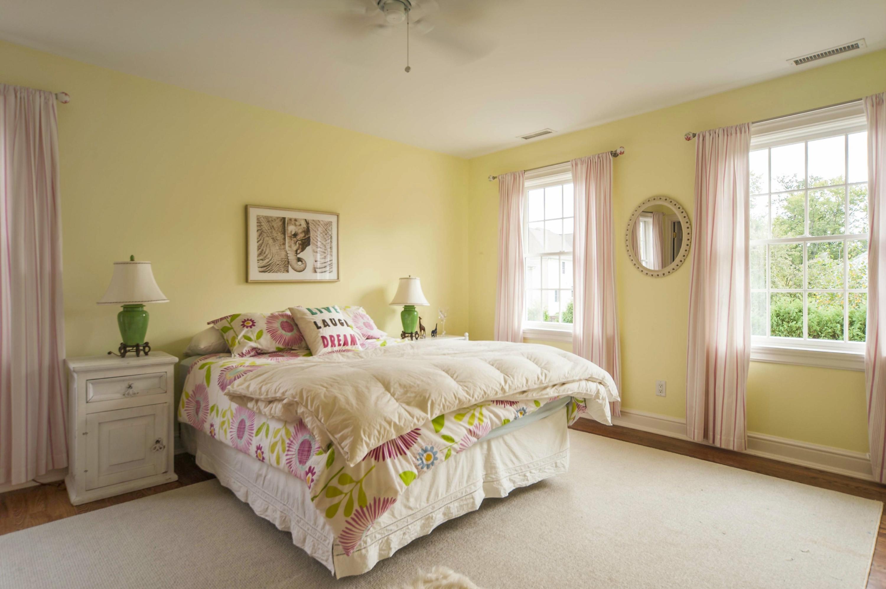 2 Hampton Road Darien, CT 06820 - Photo 18 of 25 a bedroom with a bed lamp and a window