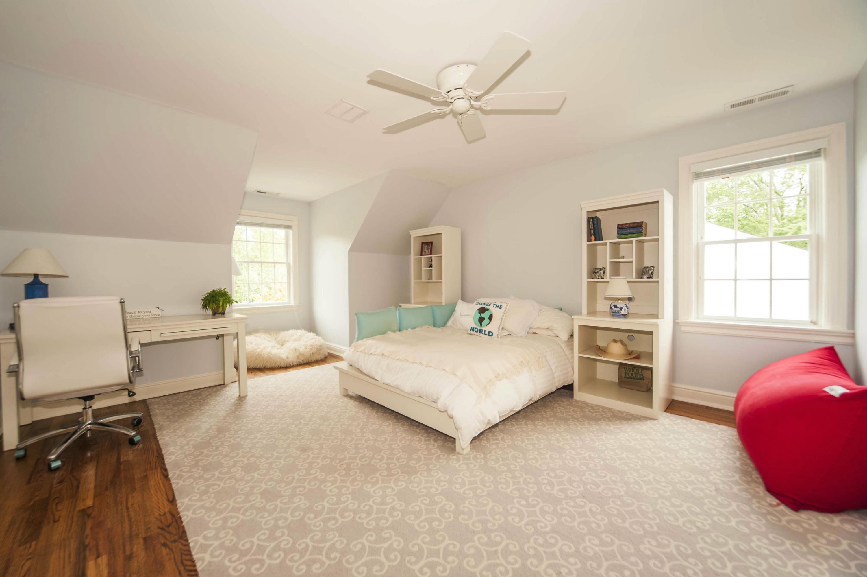 2 Hampton Road Darien, CT 06820 - Photo 19 of 25 a bed room with a bed and a chair