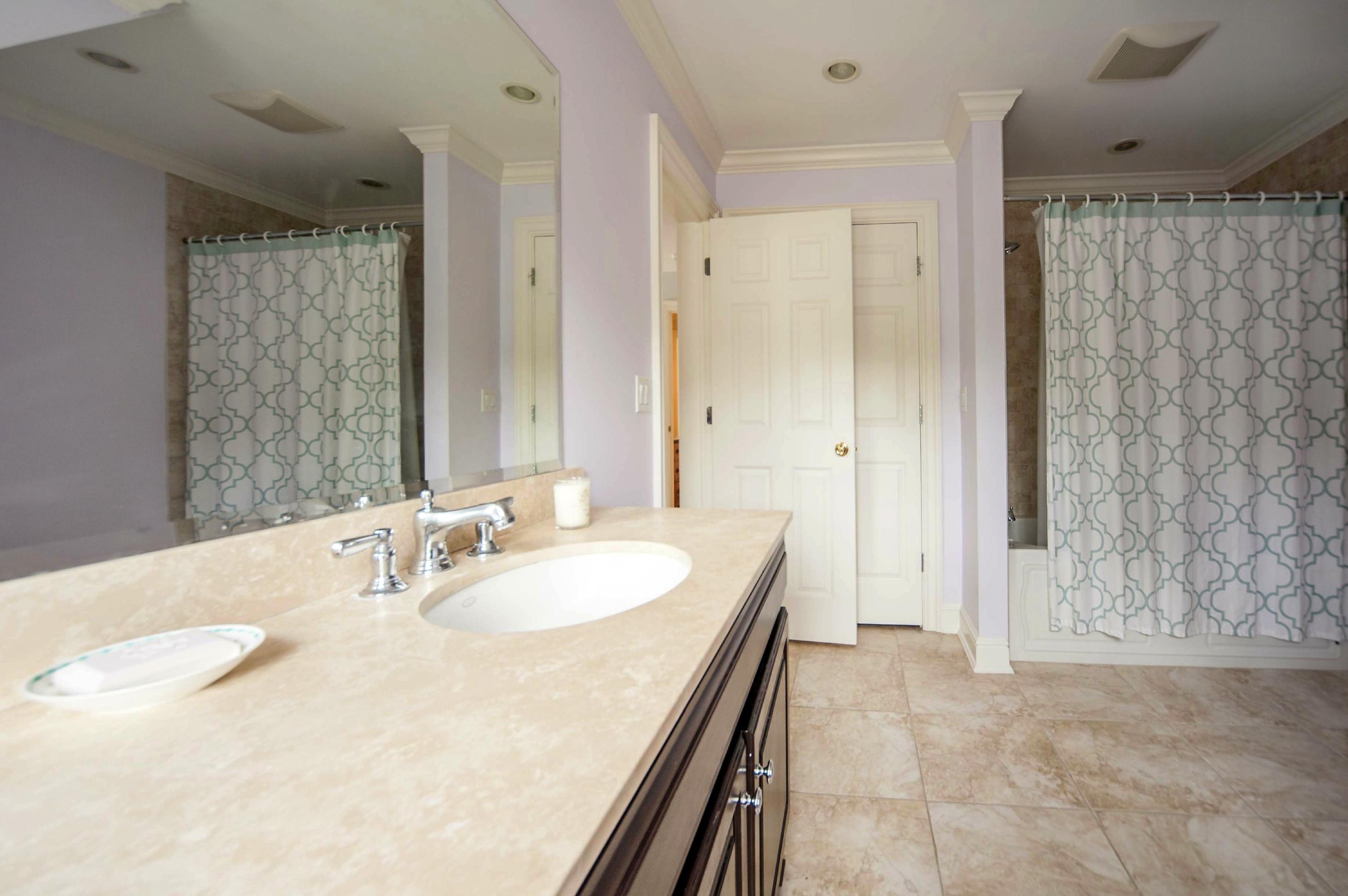 2 Hampton Road Darien, CT 06820 - Photo 20 of 25 a en suite bathroom with a double vanity sink a mirror and shower