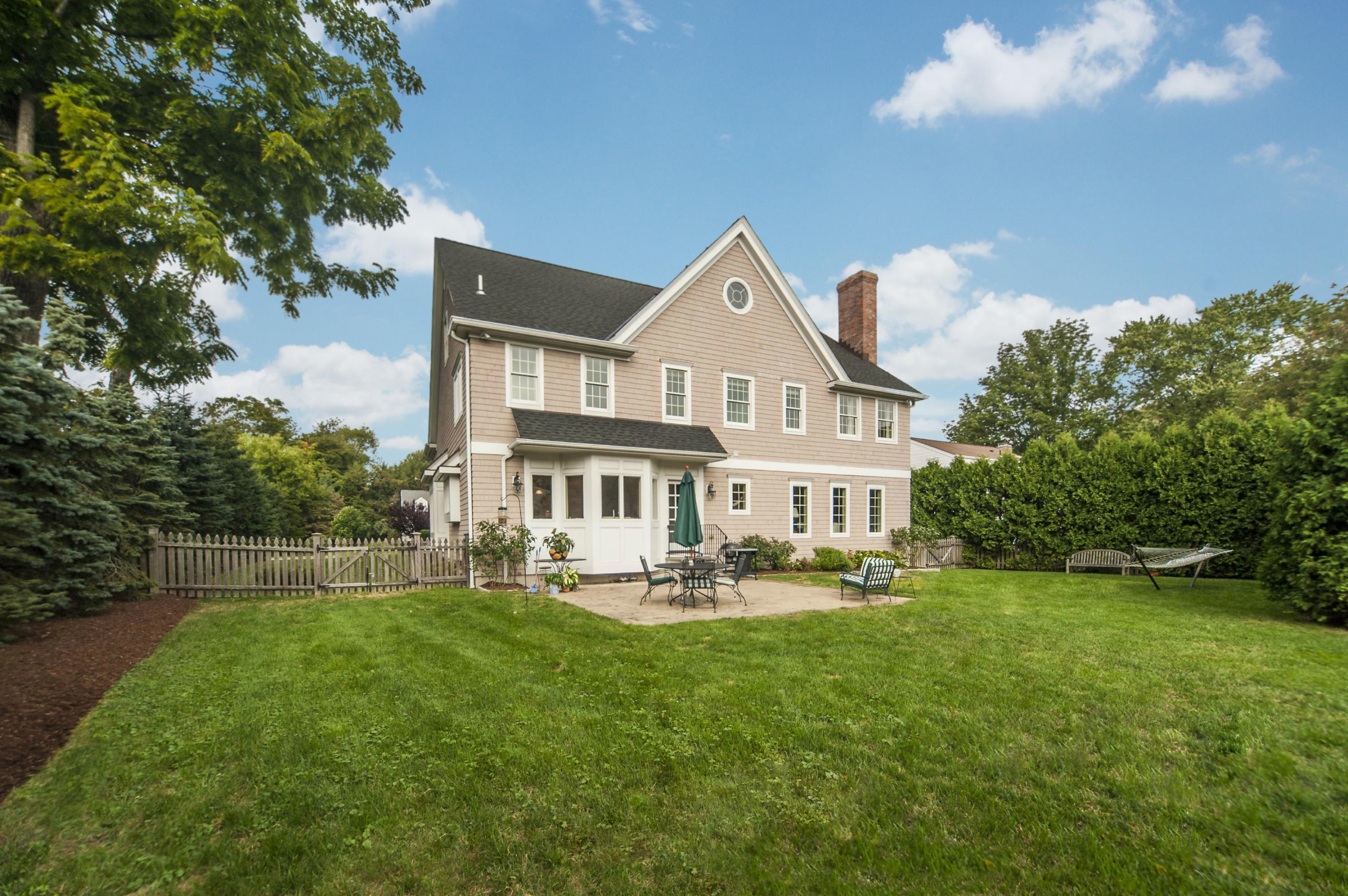 2 Hampton Road Darien, CT 06820 - Photo 25 of 25 a front view of a house with a yard table and chairs