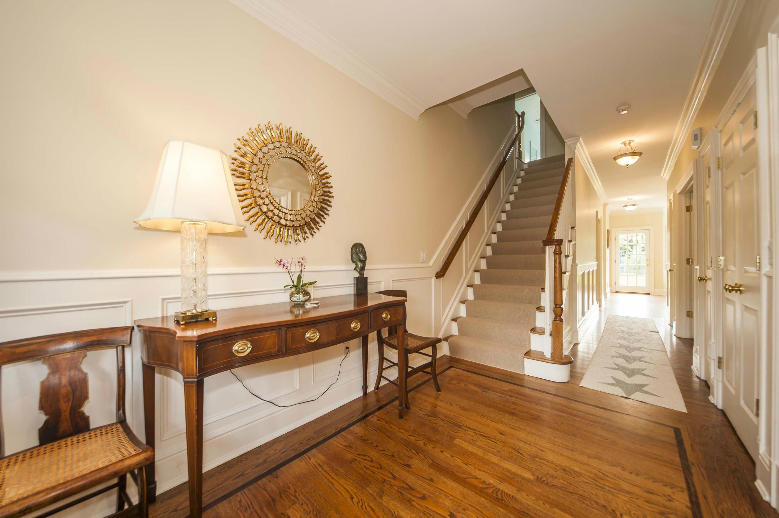 2 Hampton Road Darien, CT 06820 - Photo 3 of 25 a view of a room with shelves and wooden floor