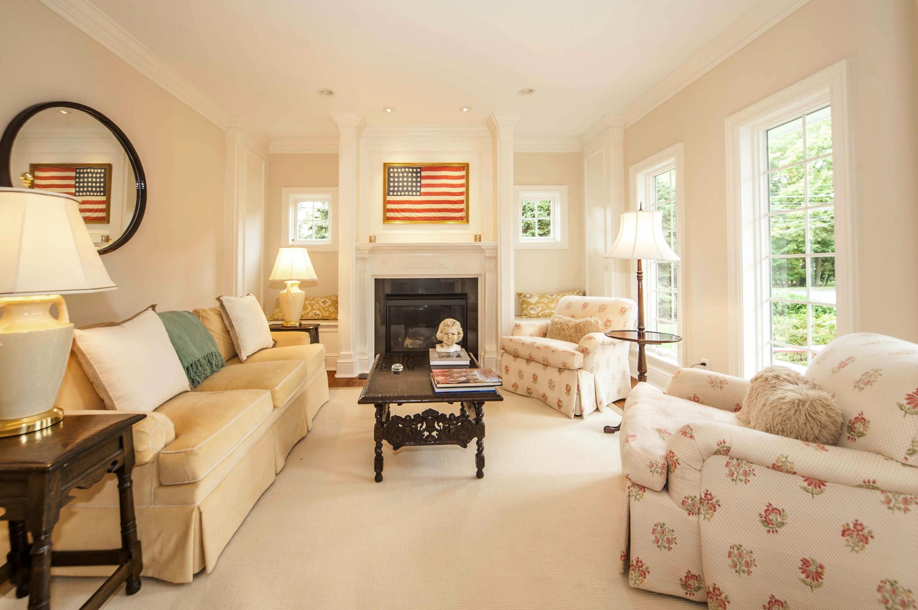 2 Hampton Road Darien, CT 06820 - Photo 4 of 25 a living room with furniture a fireplace and a large window with outer view