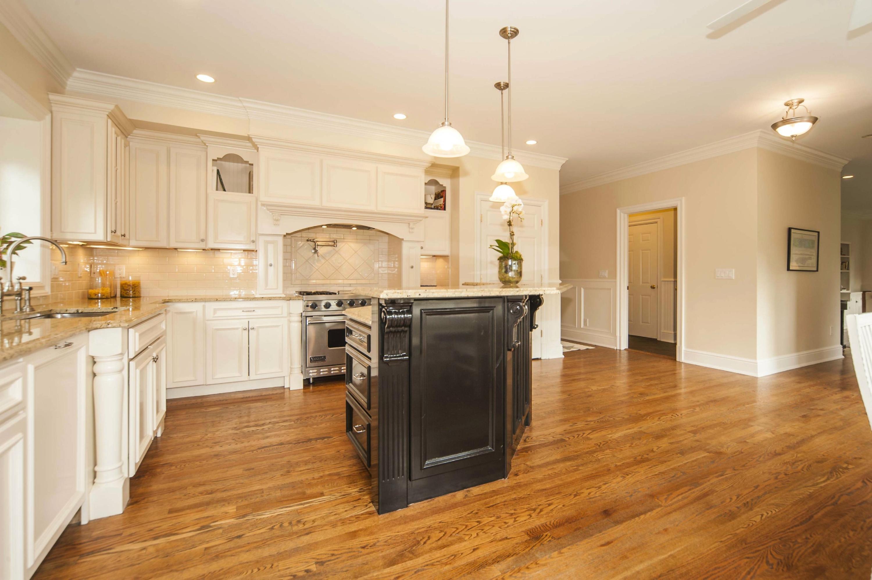 2 Hampton Road Darien, CT 06820 - Photo 7 of 25 a kitchen with stainless steel appliances granite countertop a sink a stove a refrigerator and island with wooden floor