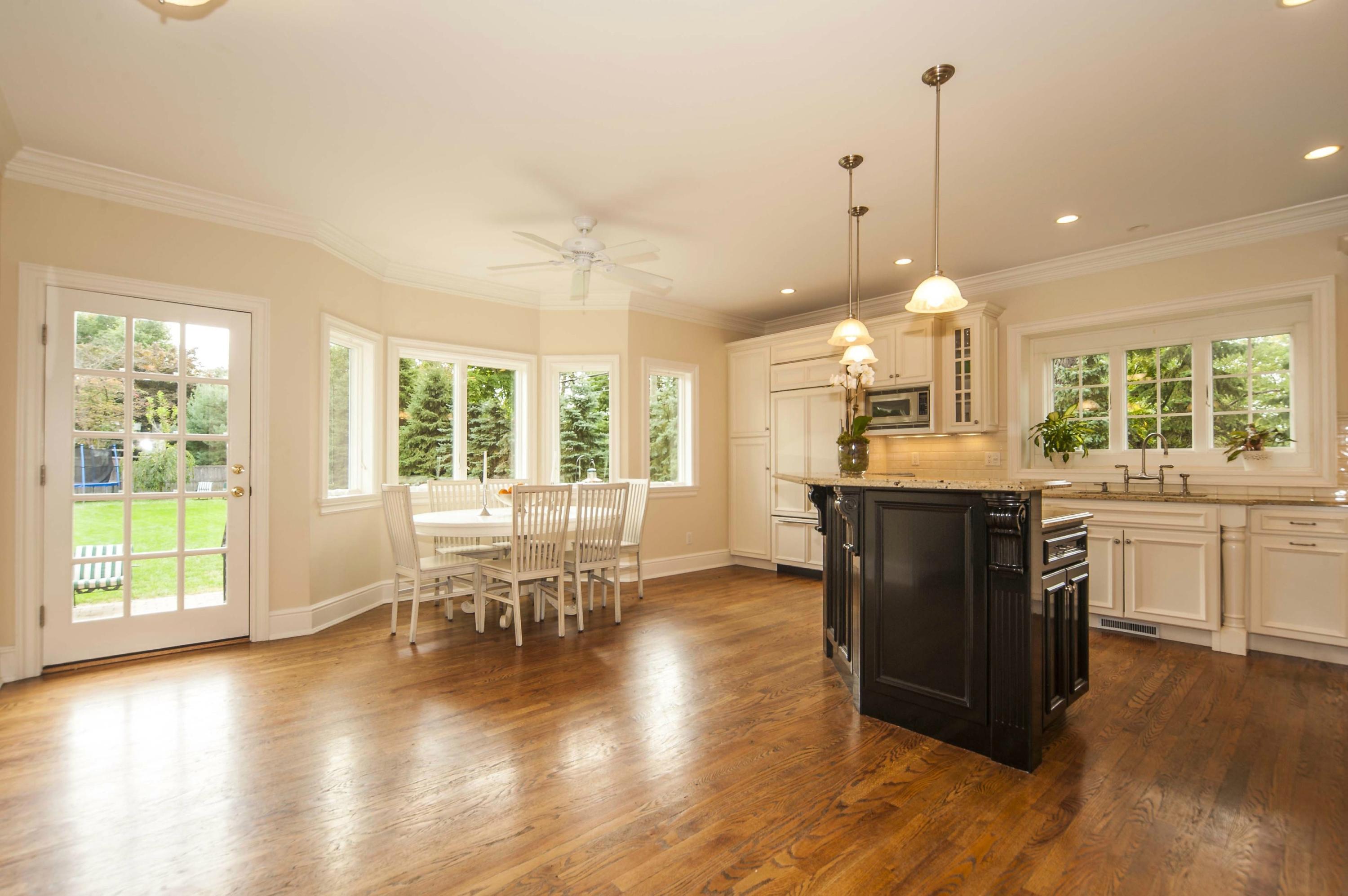 2 Hampton Road Darien, CT 06820 - Photo 9 of 25 a kitchen with a table chairs stove and wooden floor