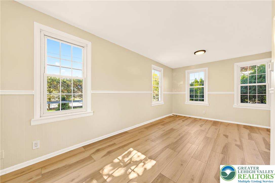 1740 Butztown Road Bethlehem, PA 18017 - Photo 11 of 29 a view of an empty room with wooden floor and a window
