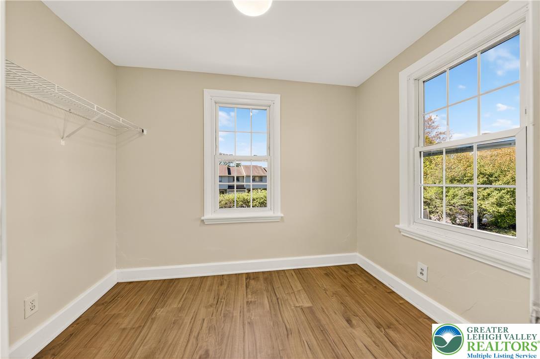 1740 Butztown Road Bethlehem, PA 18017 - Photo 14 of 29 an empty room with a window and wooden floor