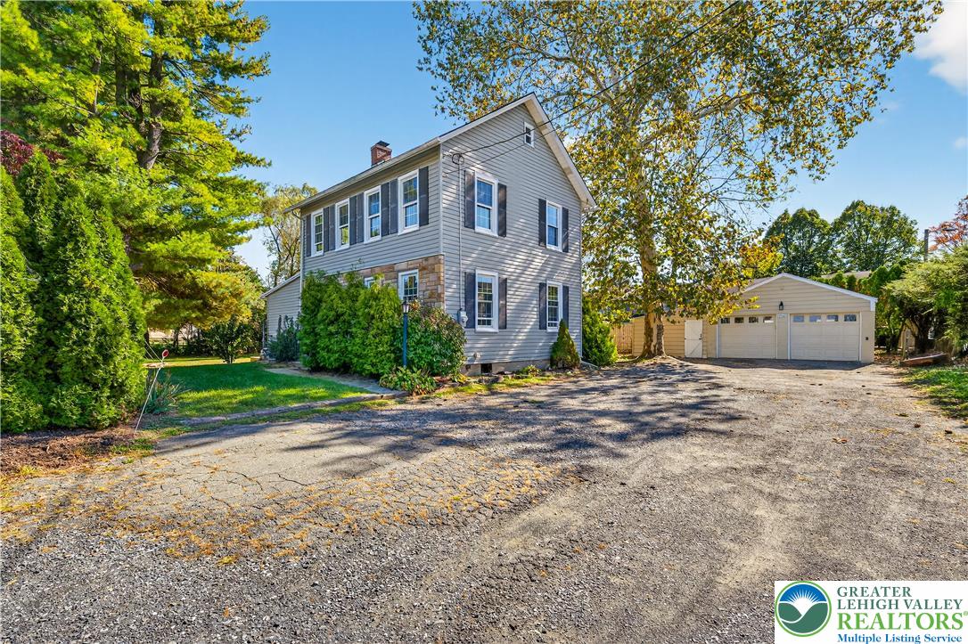 1740 Butztown Road Bethlehem, PA 18017 - Photo 2 of 29 a front view of house with yard and trees around