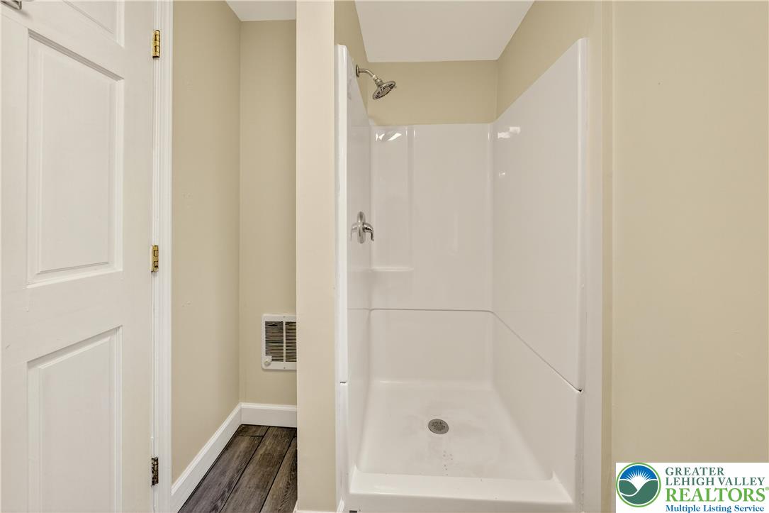 1740 Butztown Road Bethlehem, PA 18017 - Photo 24 of 29 a bathroom with a glass shower door