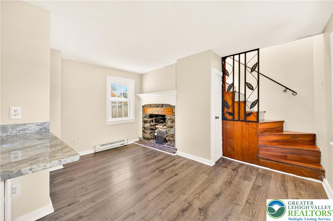 1740 Butztown Road Bethlehem, PA 18017 - Photo 25 of 29 a view of a livingroom with wooden floor and stairs