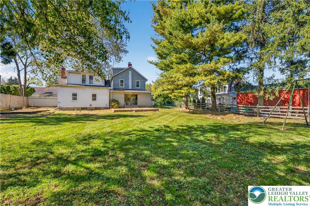 1740 Butztown Road Bethlehem, PA 18017 - Photo 29 of 29 a front view of a house with a yard and trees