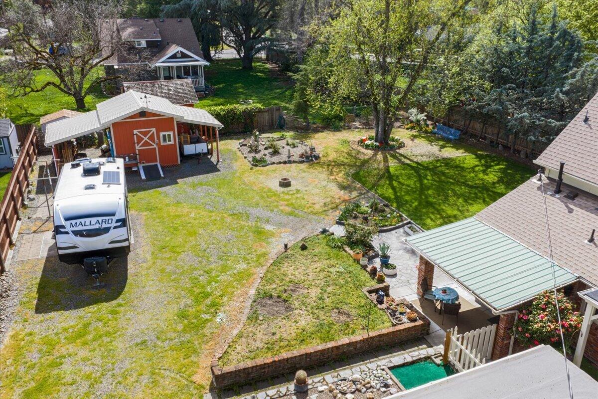 440 Bush Street Central Point, OR 97502 - Photo 35 of 40 an aerial view of a house with swimming pool garden and patio