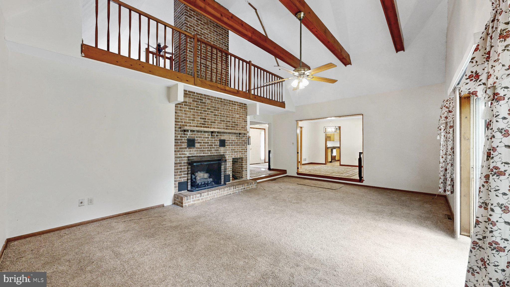 163 Pratts Branch Road Felton, DE 19943 - Photo 12 of 55 Spacious living area with rustic charm.