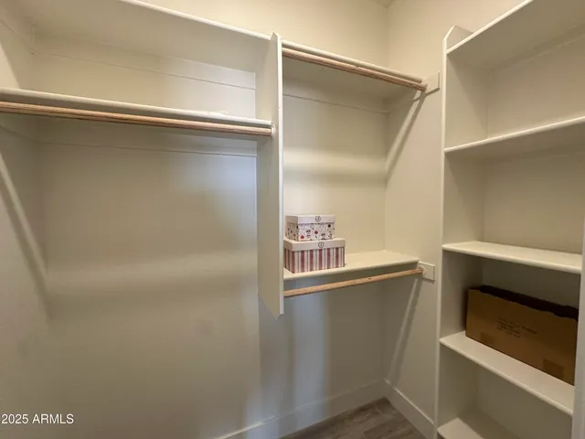 a close view of closet and wooden floor