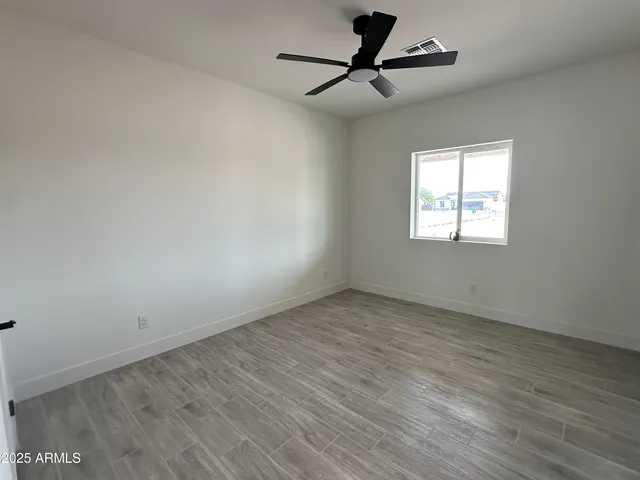 a close view of closet and wooden floor