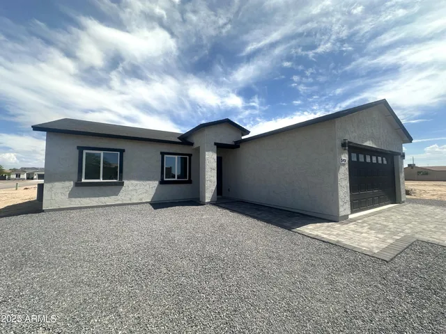 a view of a pathway both side of house