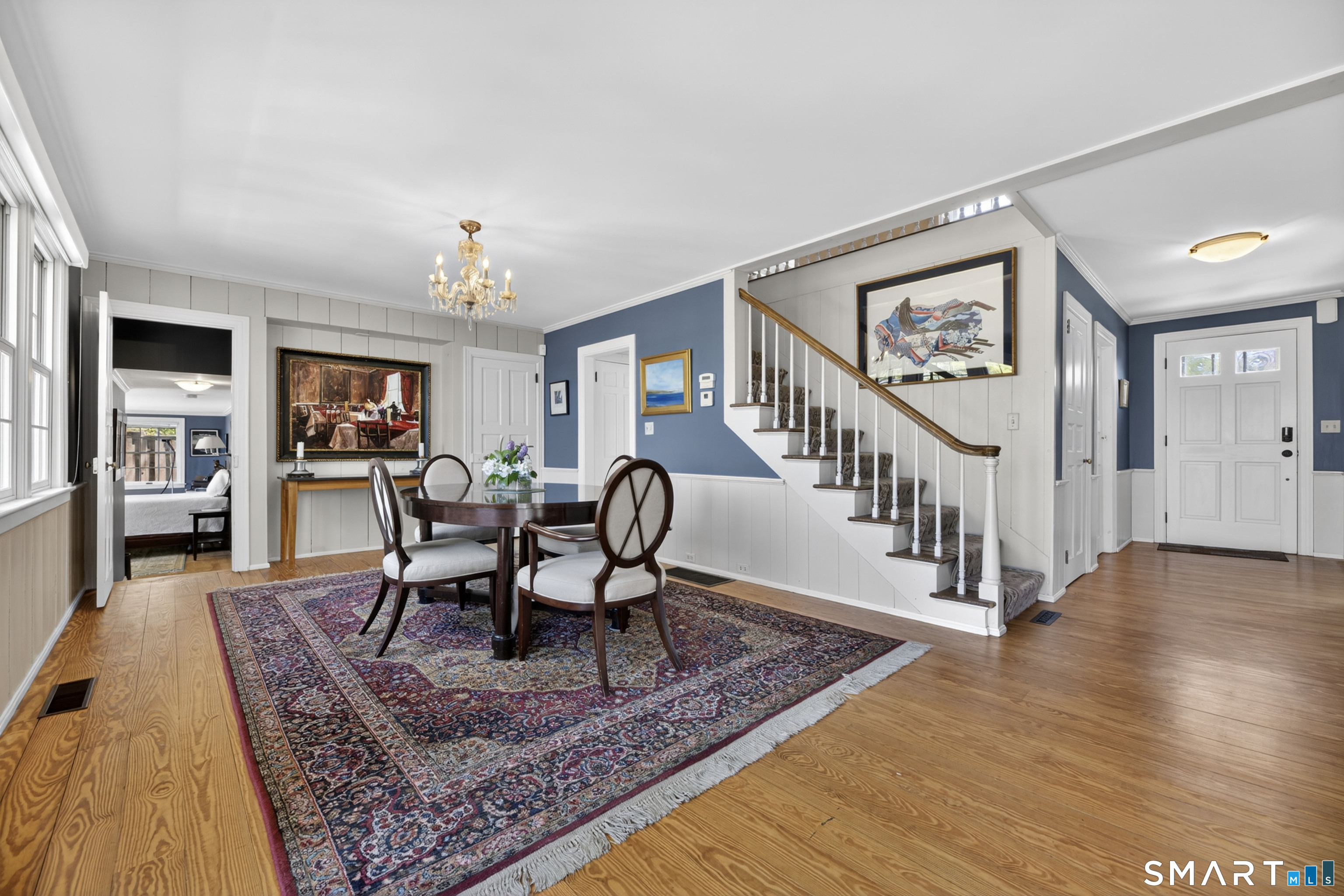 32 Money Point Road Stonington, CT 06355 - Photo 9 of 40 a dining room with wooden floor and a rug