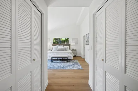 a view of a bedroom from the hallway