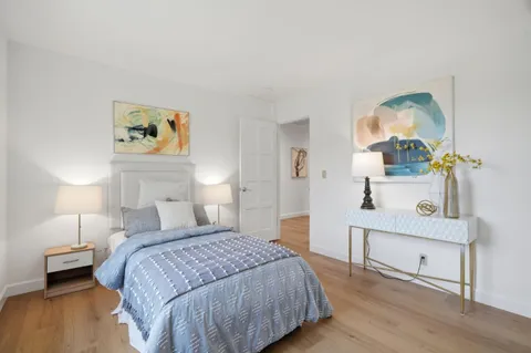 a bedroom with a bed and a dresser