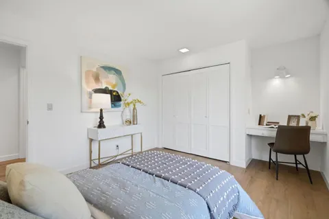 a bedroom with a bed and furniture