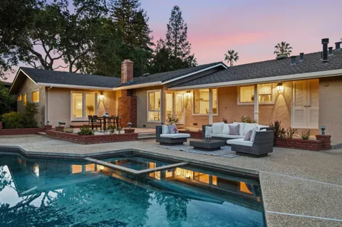 a view of swimming pool with outdoor seating