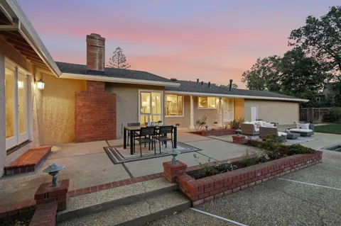 a view of a patio with couches and potted plants
