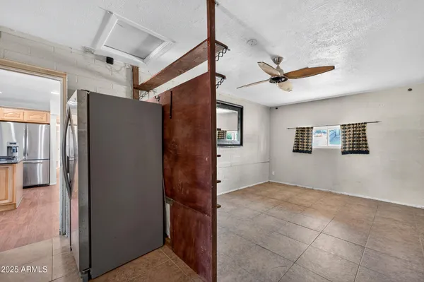 a view of livingroom with hardwood floor and a ceiling fan