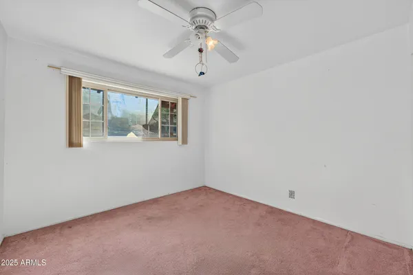 a view of hallway with wooden floor