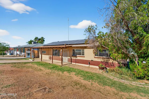 a front view of a house with garden